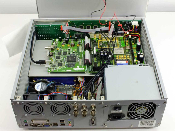 Fraunhofer IIS DT500 – internal view with top cover removed showing custom RF and digital PCBs, internal power supply, cabling, and rear panel connector assembly