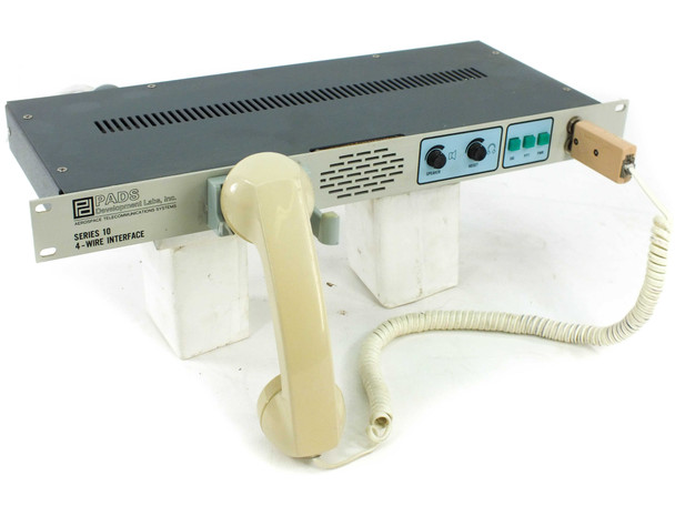 PADS Development Labs Series 10 4-Wire Voice Terminal 2000121-100 front panel with telephone handset resting on top, 19-inch 1U rackmount chassis