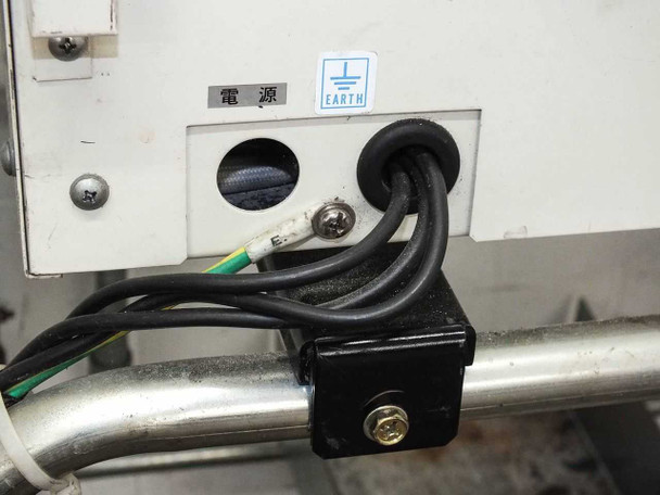 Mitsubishi MD-60TE power entry panel showing cut power cables at the electrical inlet with earth ground label