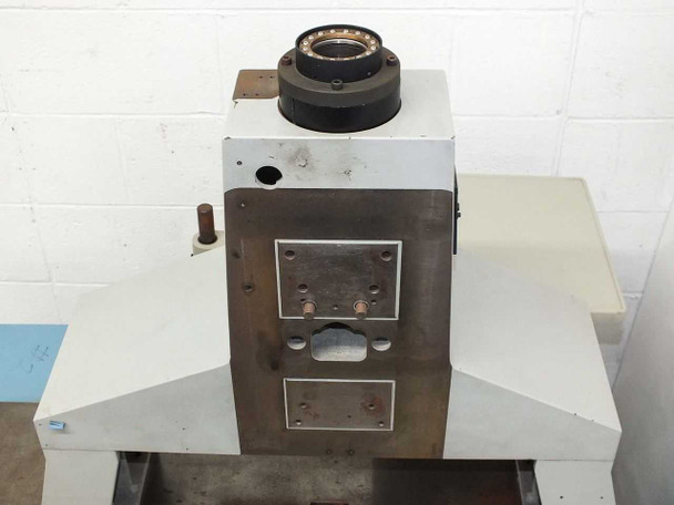 Front view of optical column tower with large-bore spindle bearing housing mounted on top and open aperture below