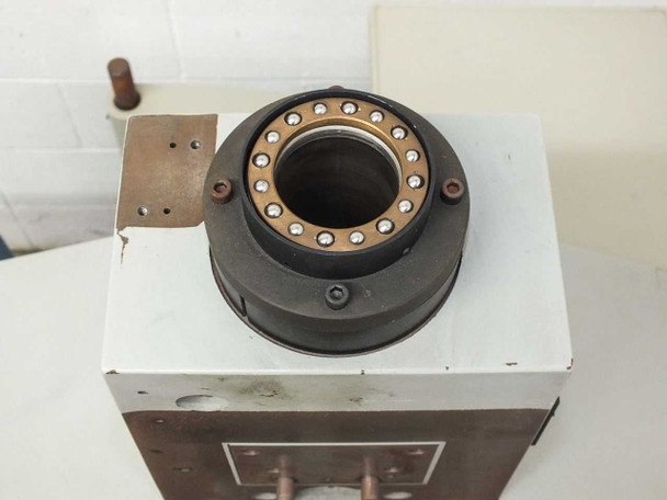Close-up top view of large-bore spindle bearing housing on column top showing ball bearing ring and bronze race
