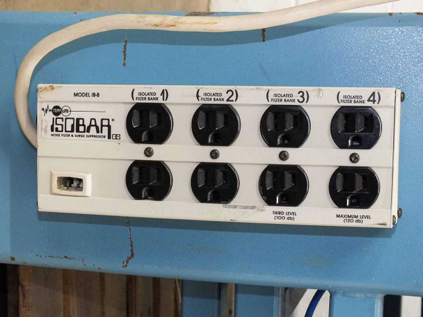 Close-up of Tripp Lite Isobar IB-8 model label showing four isolated filter banks and 8 outlets