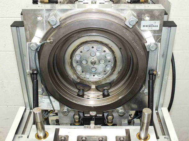 Balzers BPS Swivel 98 1.5 Metalizer – front view of opened vacuum chamber showing dark-coated target plate and process chamber interior with mounting hardware