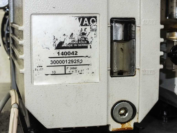 Leybold Trivac D10E roughing pump label showing part number 140042 and serial number 30000129250 with P 10 mbar rating