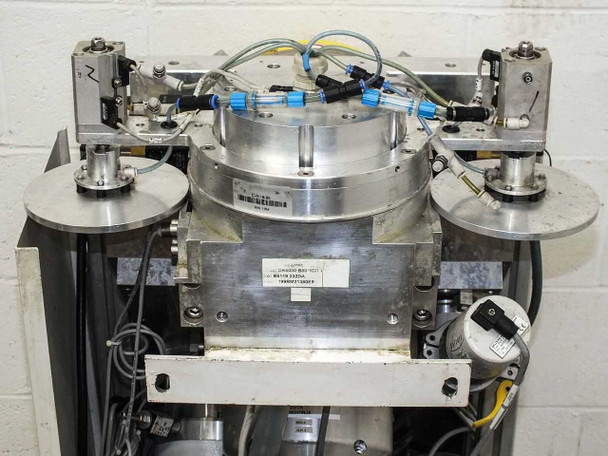 Balzers BPS Swivel 98 1.5 Metalizer – front of vacuum chamber assembly showing aluminum flanges, pneumatic actuators on sides, and a label on the chamber body