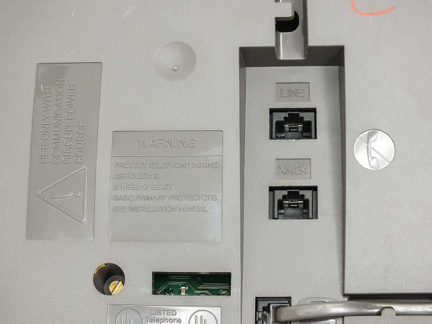 Lucent 6424D+ bottom ports showing RJ-45 LINE and XM/24 jacks, communication circuit power source warning label, and UL Listed marking