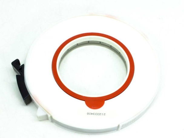 Scotch 777 9-track tape reel – rear view showing white plastic housing with orange hub ring, black locking clip, and serial number label