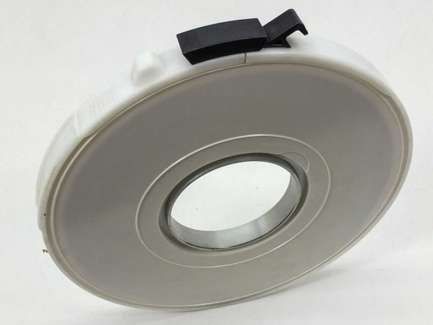 9-Track 1/2-inch magnetic tape reel in Wright Line gray plastic canister – side profile view showing reel hub and canister latch