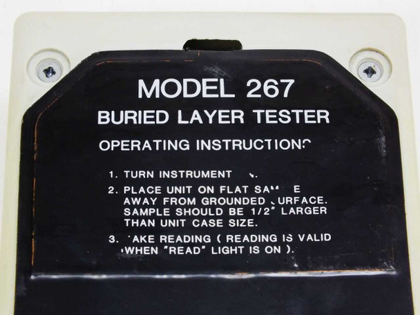 Close-up of Monroe Electronics Model 267 Buried Layer Tester operating instructions label on bottom of unit