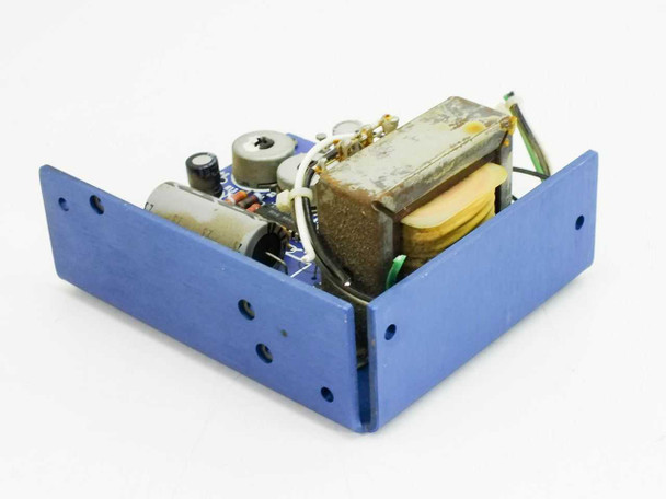 Standard Power SPS 15-15 open-frame power supply in blue chassis — angled front-left view showing transformer and PCB components