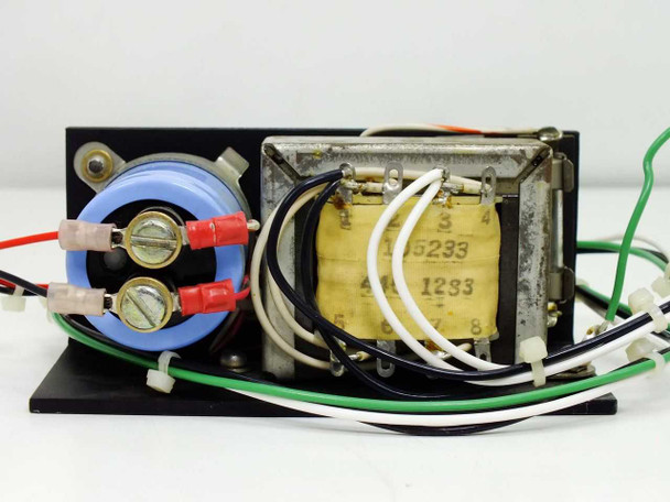 Standard Power 15B24H power supply – rear view showing transformer lamination stack with winding labels and terminal connections with red and black leads