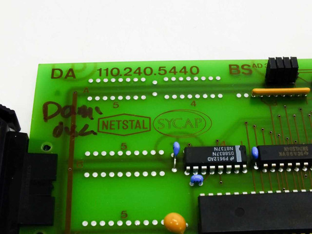 Netstal DA 110.240.5440 board label close-up showing part number, Netstal Sycap markings, BS AD designation, and IC chips