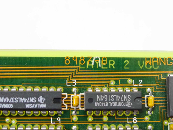 Wang 8987-0 PCB close-up of board marking '8987AB LAYER 2 WANG' with TI SN74LS164N and SN74ALS374AN ICs visible