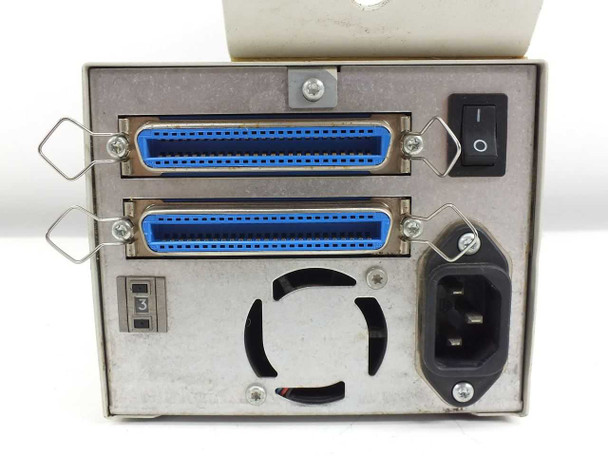 HP C1523E JetStore 2000 rear panel showing dual 50-pin Centronics SCSI connectors, IEC power inlet, cooling vent, rocker power switch, and SCSI ID selector switch set to 3