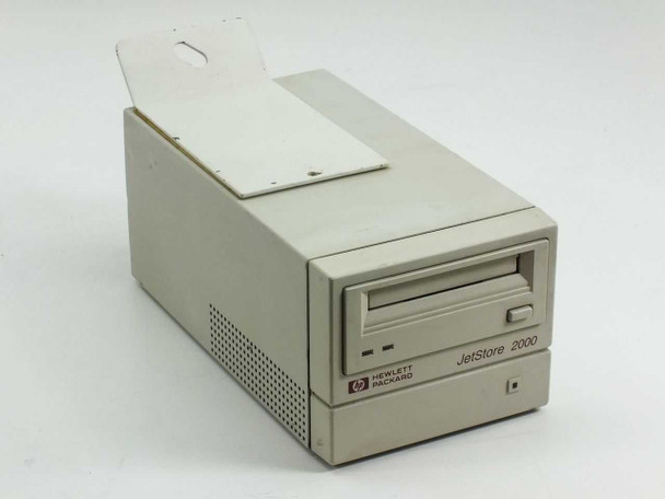 HP C1523E JetStore 2000 External SCSI Tape Drive — front and right side view showing tape slot and HP Hewlett Packard branding