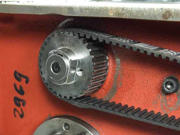 Close-up of secondary drive sprocket and dual HTD timing belt arrangement on HC0110S belt drive assembly