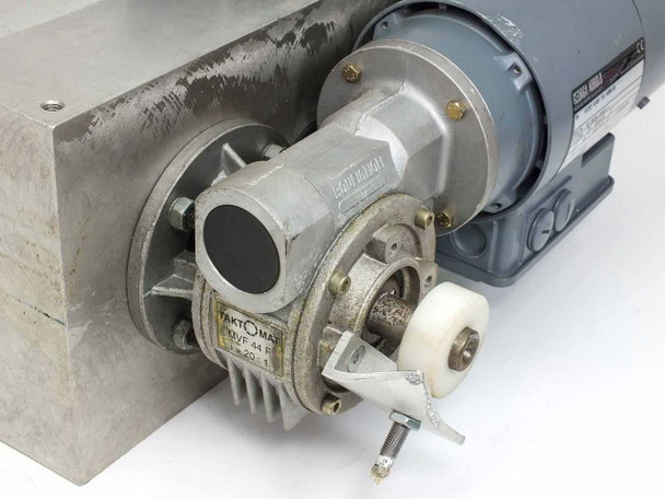 Taktomat IP 80 E close-up of input gearhead and cam indexer housing showing Taktomat label and drive shaft coupling
