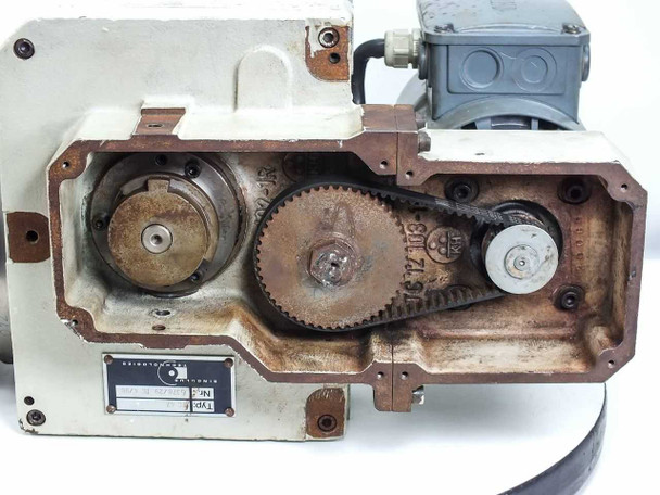 Singulus TC 47 – open belt and pulley housing showing gear train, timing belt, and drive sprockets with side panel removed
