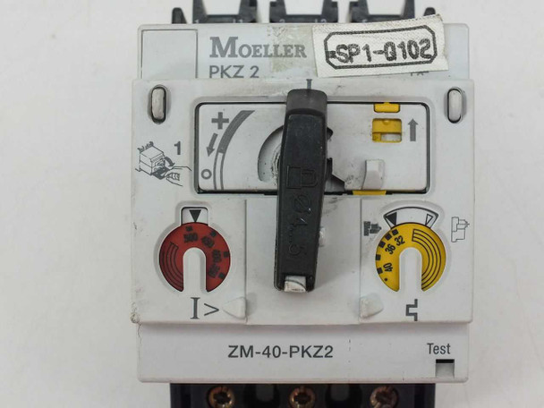 Eaton Moeller ZM-40-PKZ2 close-up of front face showing Moeller PKZ2 branding, rotary ON/OFF handle, red overcurrent indicator (I>), yellow thermal adjustment dial, and Test button