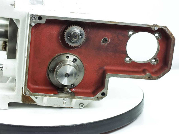 Singulus TC3-5--03 – open gear cavity view showing spur gear, secondary timing gear, and precision flanged output shaft against red-painted housing wall