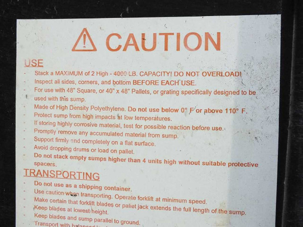 Caution label on sump side panel showing 4000 lb capacity, temperature range 0–110°F, compatible pallet sizes, and HDPE material callout