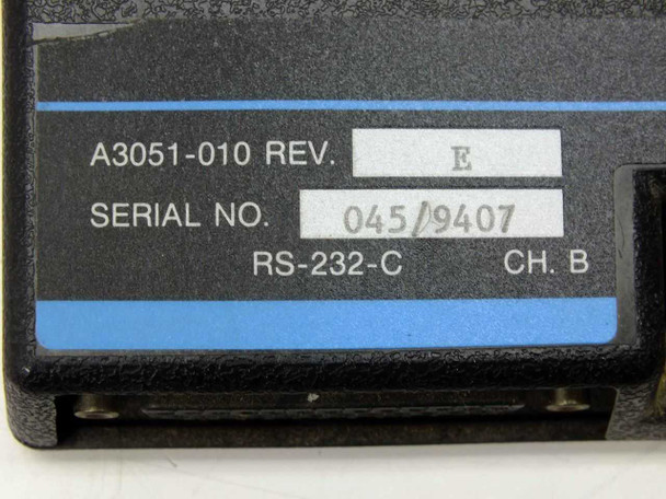 Spectra Physics A3051-010 label close-up showing model A3051-010 Rev E, Serial No. 045/9407, RS-232-C Ch. B