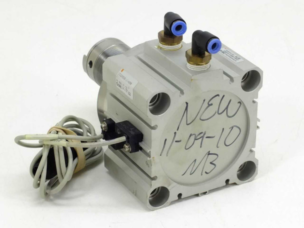 SMC CDQ2KB80-UIA980 pneumatic cylinder – side view showing aluminum body with handwritten label and push-in elbow fittings on top