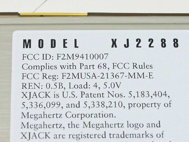 Close-up of Megahertz XJ2288 model label showing FCC ID F2M9410007 and FCC Reg F2MUSA-21367-MM-E