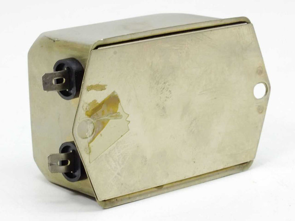 Schaffner FN2060-16-06 EMI line filter – rear/side view showing chassis and blade terminals with adhesive label residue