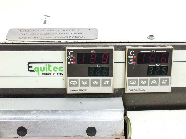 Close-up of dual Omron E5CW temperature controllers showing PV and SV digital readouts in degrees Celsius