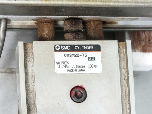 SMC CXSM20-75 XU pneumatic cylinder label showing max pressure 0.7 MPa / 100 PSI