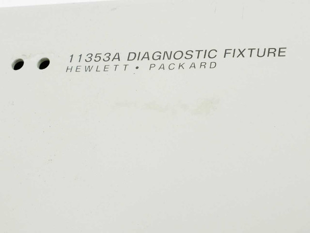 HP 11353A label close-up — engraved text reads '11353A DIAGNOSTIC FIXTURE / HEWLETT • PACKARD'