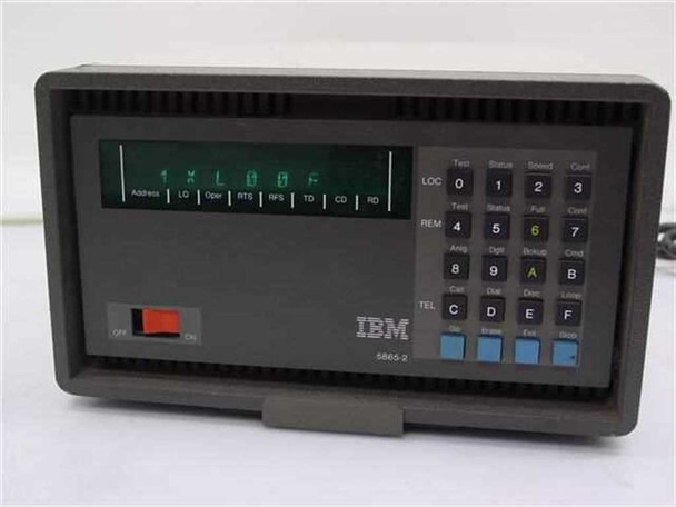 IBM 5865-2 modem front panel view showing green LED status display, LOC/REM/TEL keypad, and IBM logo on dark gray desktop enclosure