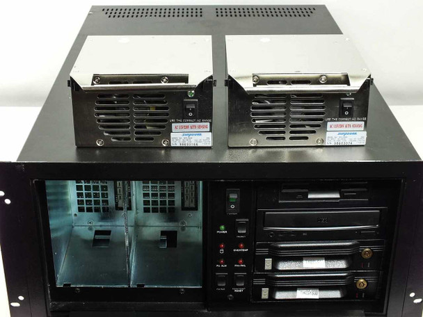 DiviCom NMS-RM-NM server with top cover removed showing dual power supply modules on top and internal drive and card cage layout