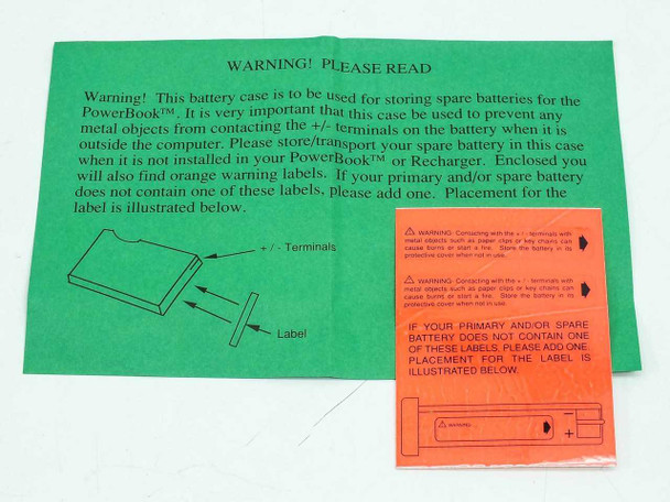 Apple PowerBook 140/170 battery case warning inserts — green sheet and orange warning labels