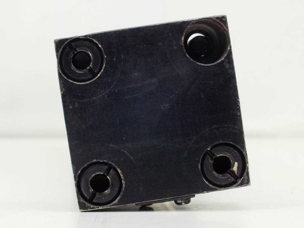 Norgren pneumatic cylinder – rear cap face view showing four bolt hole positions with one bolt absent