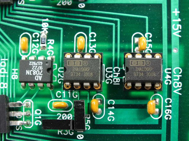 Keithley AMC ELM Electronics ACM card — macro close-up showing Burr-Brown INA106KP instrumentation amp ICs (date code 9734 3008) and AD708JN op-amp (date code 67922)
