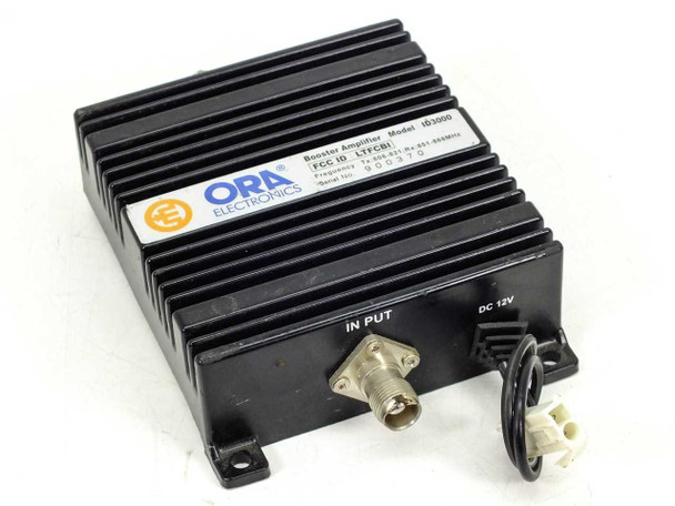ORA Electronics ID3000 Booster Amplifier – front-left view showing BNC input connector and DC 12V power connector with heatsink enclosure