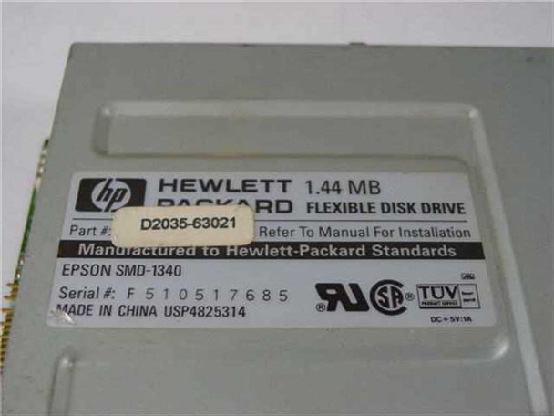 HP D2035-63021 drive label close-up showing part number D2035-63021, Epson SMD-1340, serial number, Made in China, DC +5V rating, UL and TUV marks