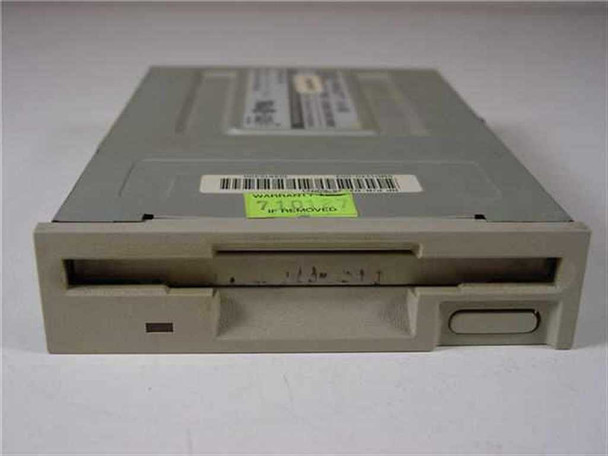 HP D2035-63021 1.44MB 3.5" Floppy Drive front view showing beige faceplate, disk slot, eject button, and green warranty void sticker