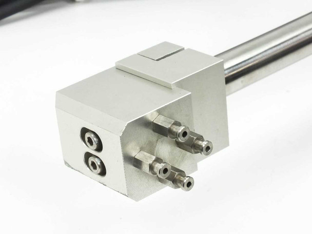 SMC CDRQB pneumatic linear rail end block closeup showing pneumatic port fittings and mounting face
