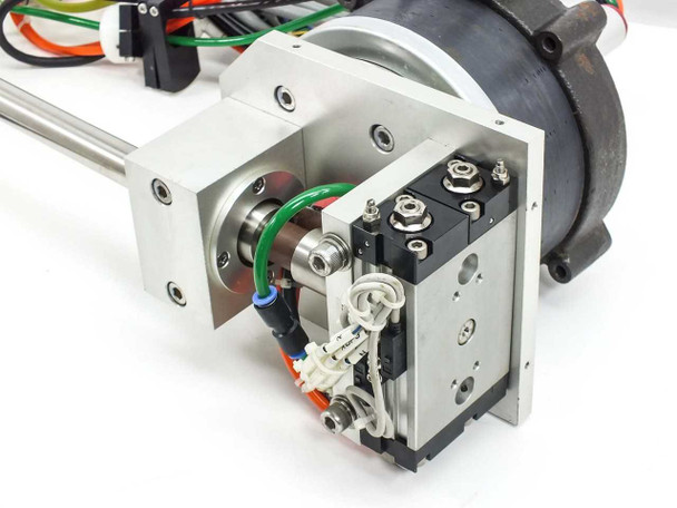 Side view of NSK YS2020FN001 motor assembly showing aluminum mounting bracket, actuator body, and pneumatic connections