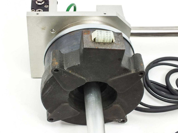 Rear view of NSK YS2020FN001 rotary motor showing cast motor housing, shaft opening, and white multi-pin connector