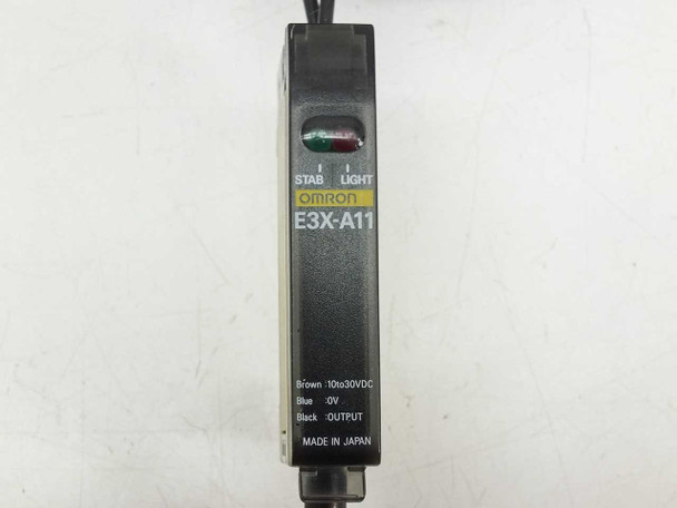 Omron E3X-A11 front label showing model, STAB and LIGHT indicators, wire color wiring diagram, Made in Japan