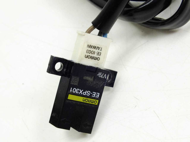 Omron EE-SPX301 sensor body close-up showing yellow model label and Omron EE-1003 Taiwan connector label