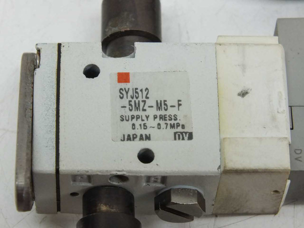 SMC SYJ512-5MZ-M5-F valve label close-up showing model number, supply pressure 0.15–0.7 MPa, and Japan origin marking