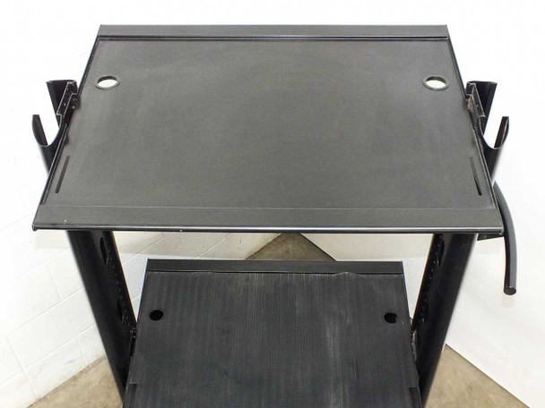 Top-down view of upper adjustable shelf (30.5x21 inches) with cable management holes and side brackets