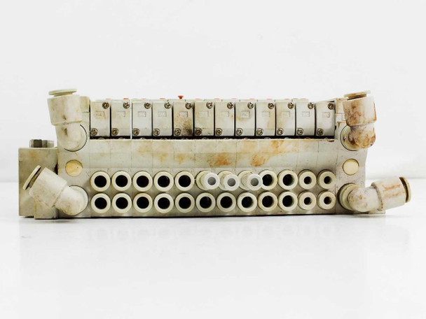 SMC VQ1000 series valve manifold – bottom/port face view showing pneumatic outlet fittings and push-in connectors