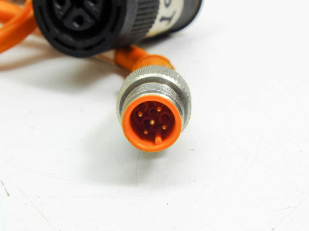 Close-up of M12 5-pin male straight connector showing 5 contact pins