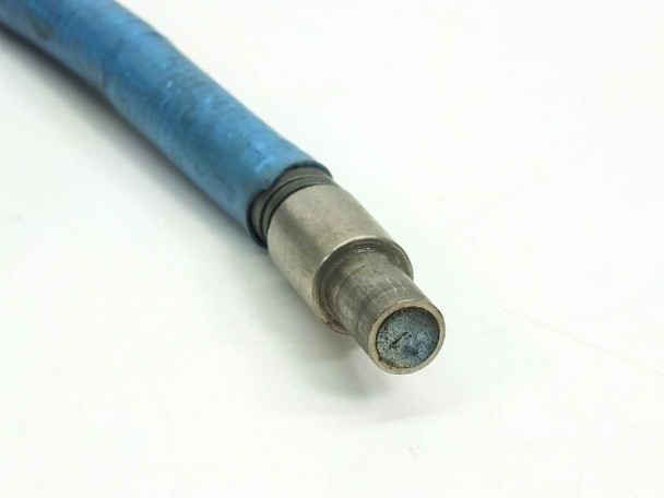 Close-up of the single input connector tip — blue vinyl jacket with metal ferrule showing fiber bundle face end-on, with discoloration visible on the fiber bundle face